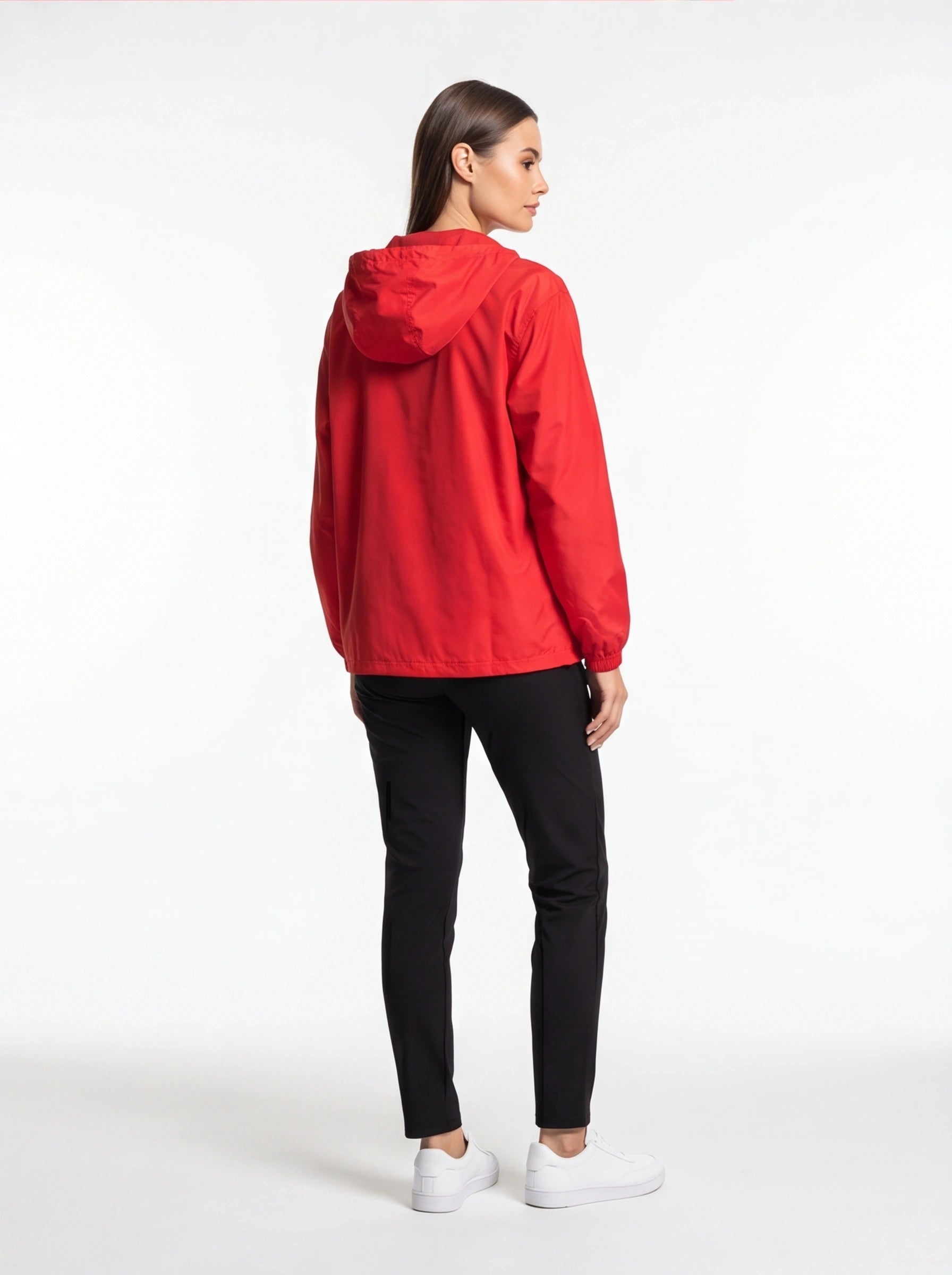 Person wearing a red raincoat on a white background